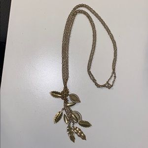 Long gold feather necklace